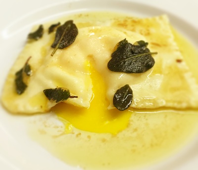 egg yolk raviolo with crispy sage, parmigiano and runny egg yolk
