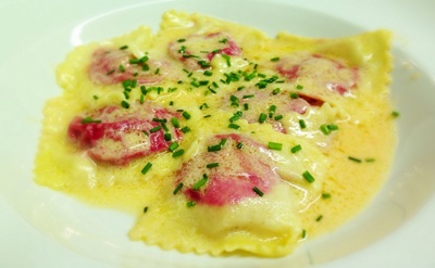 roasted beet ravioli with orange beurre blanc and chives